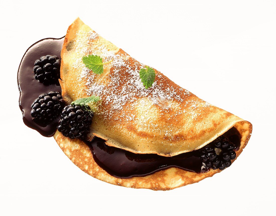 Crepe with blackberries and blackberry sauce