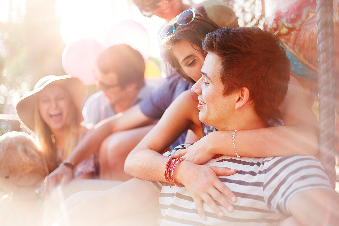 Young couple kissing summer outdoors