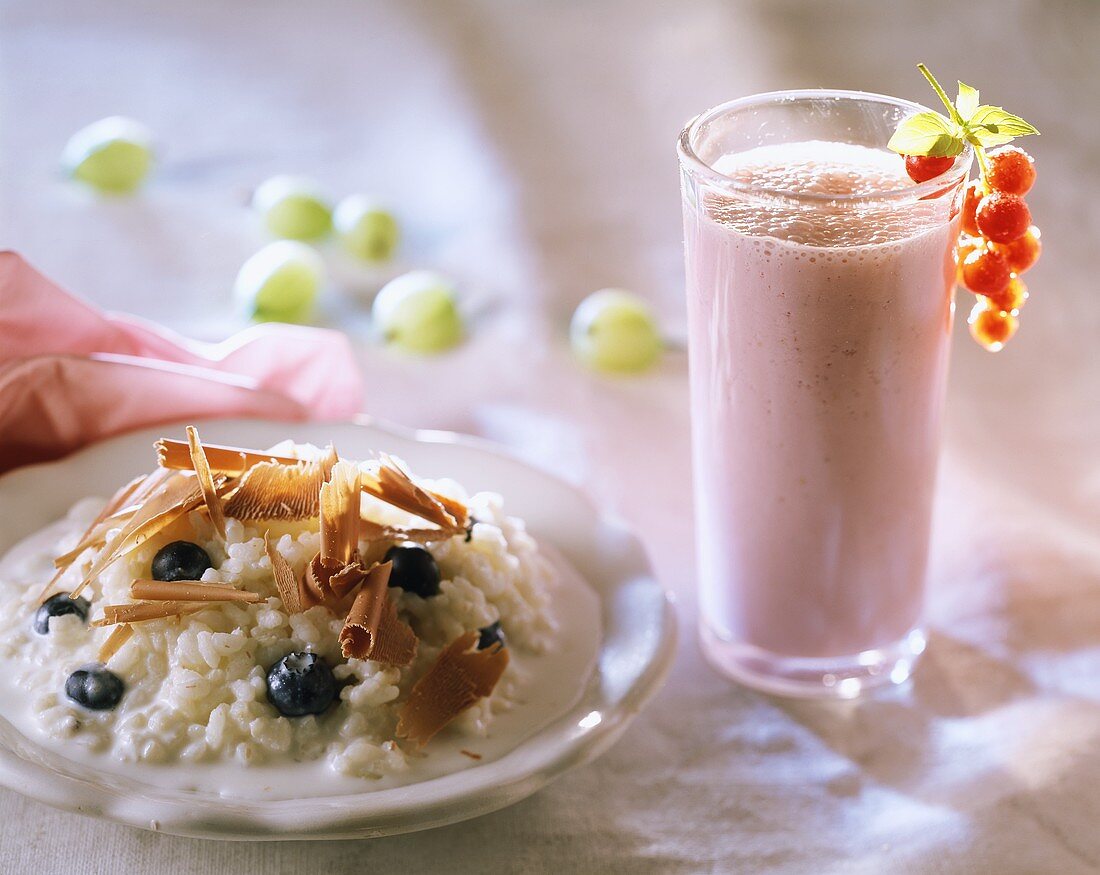 Rice pudding, blueberries & chocolate curls; berry milkshake