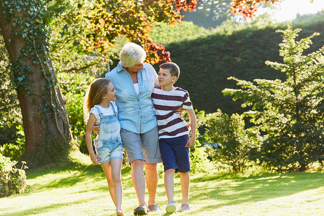 Grandmother and grandchildren walking