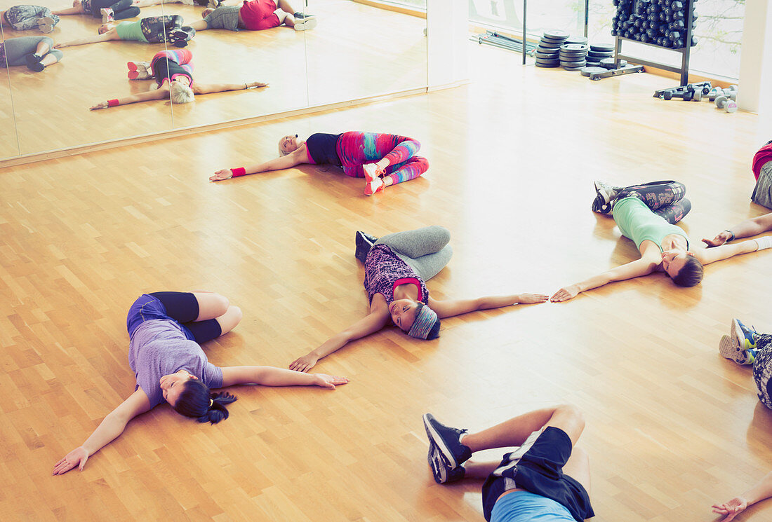 Exercise class doing twisted stretch