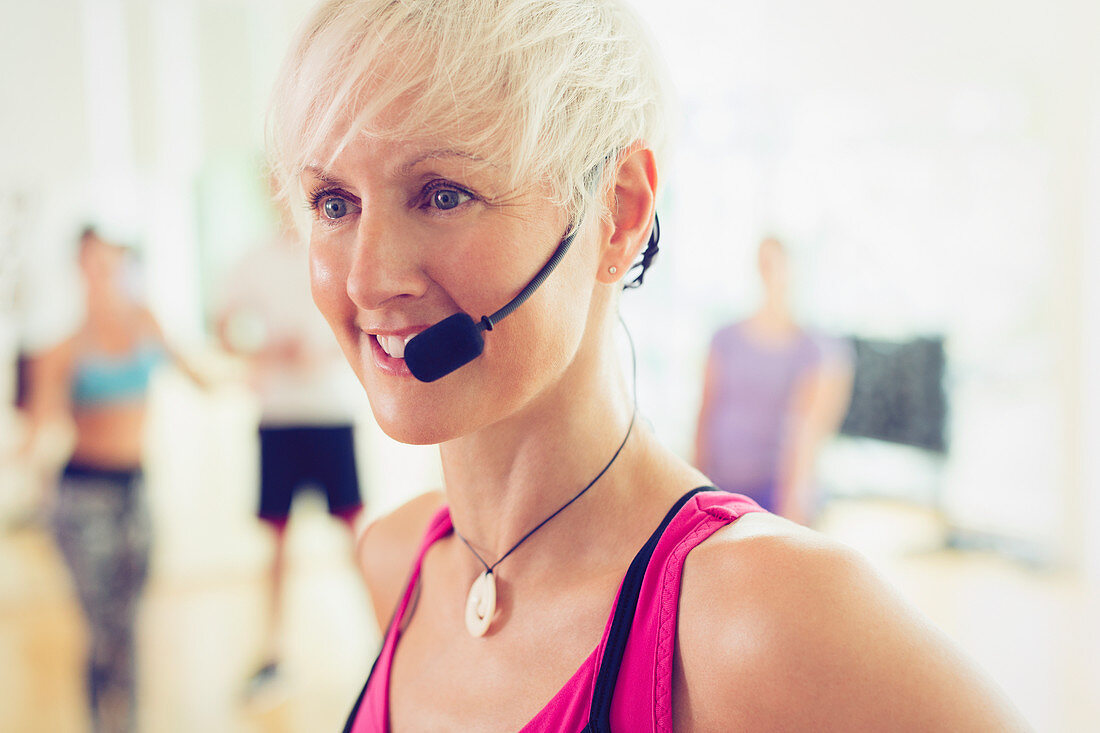 Close up fitness instructor with headset