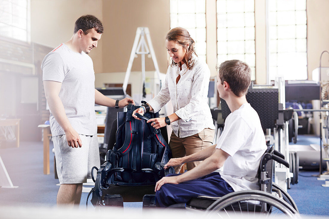 Physical therapists with wheelchair user
