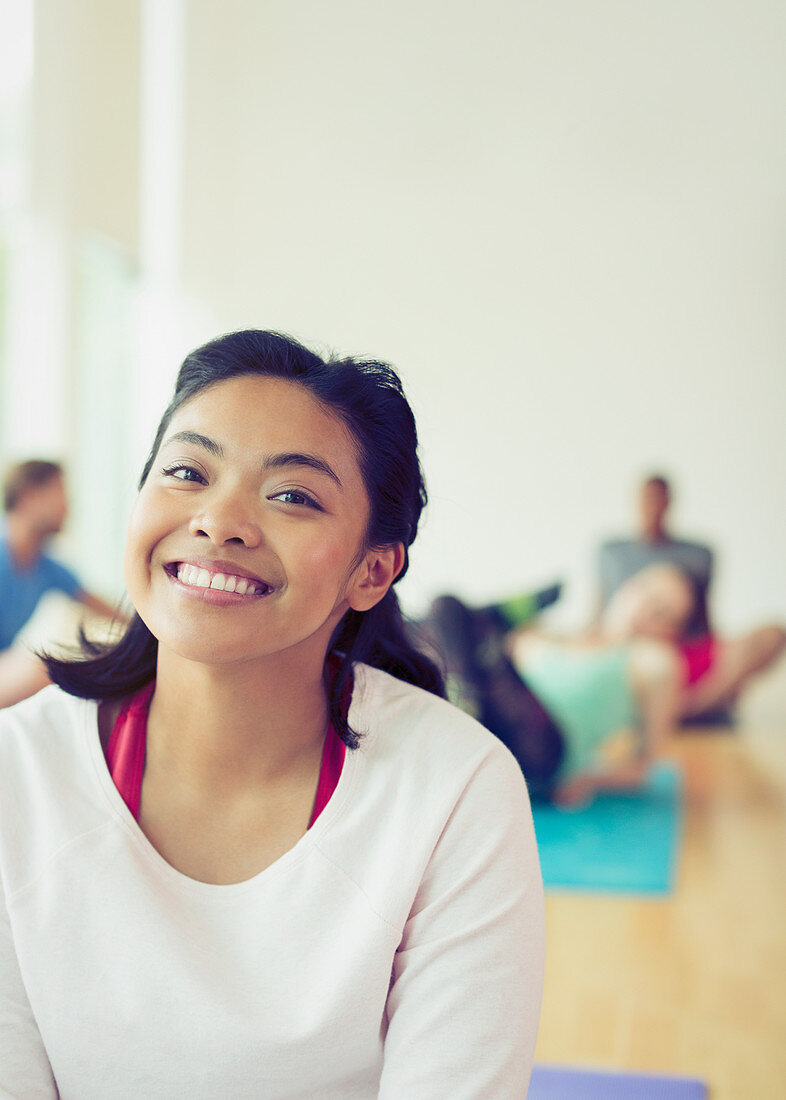 Portrait smiling woman in yoga class