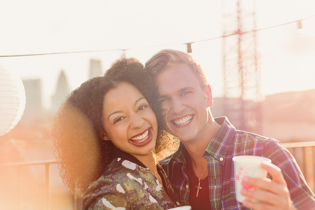 Young couple enjoying rooftop party