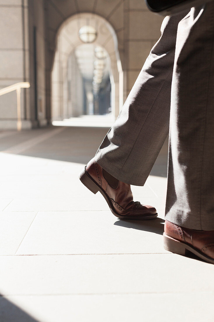 Feet of Businessman walking