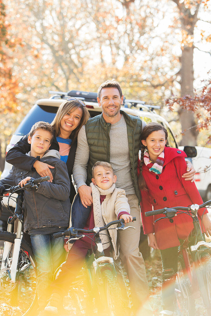 Family with mountain bikes outdoors