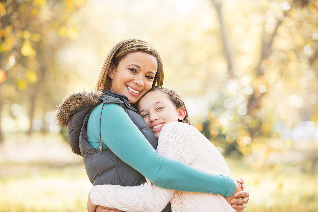 Mother and daughter hugging