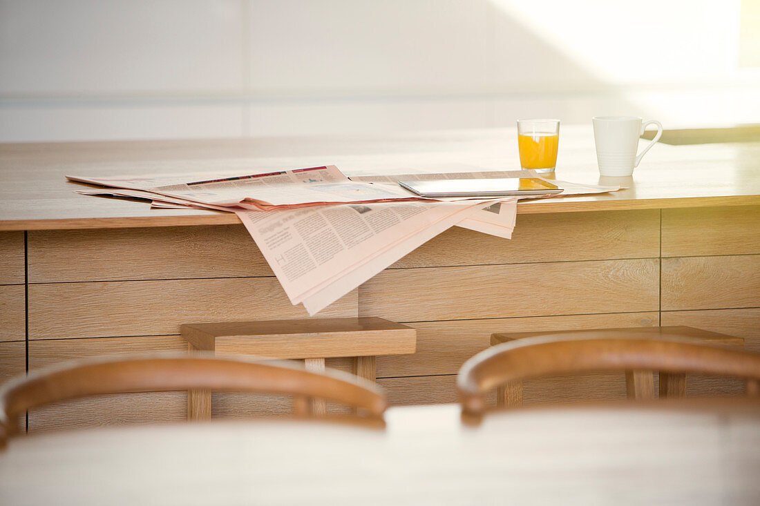 Newspaper, orange juice and coffee
