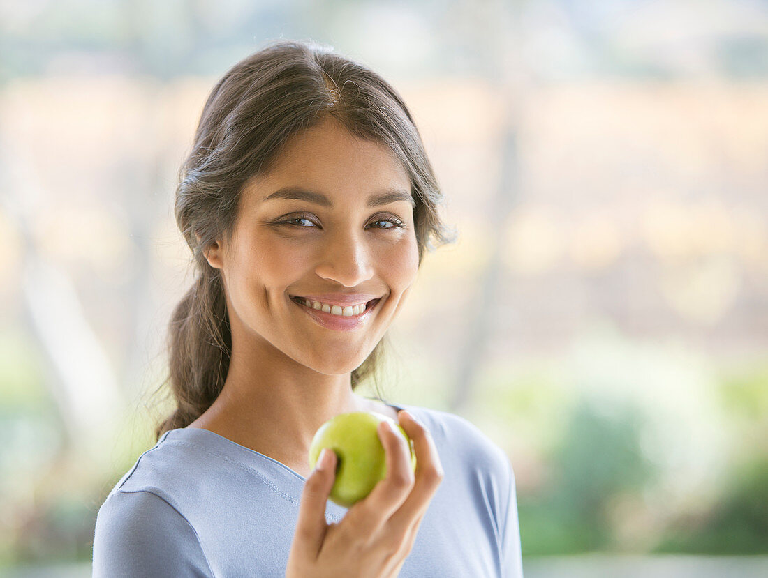 Close up Woman eating green apple