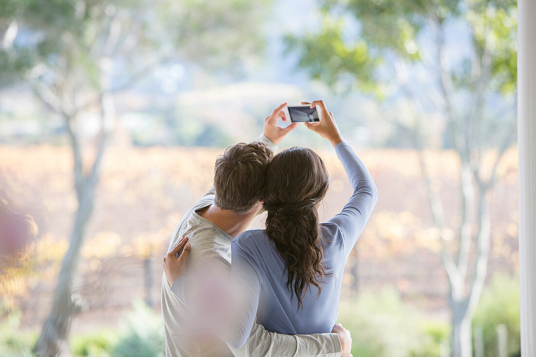 Couple taking selfie on patio