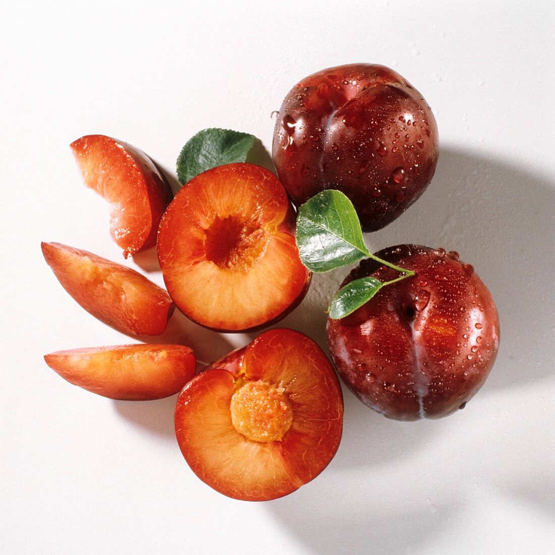 Two Whole Plums; A Halved Plum; Plum Slices
