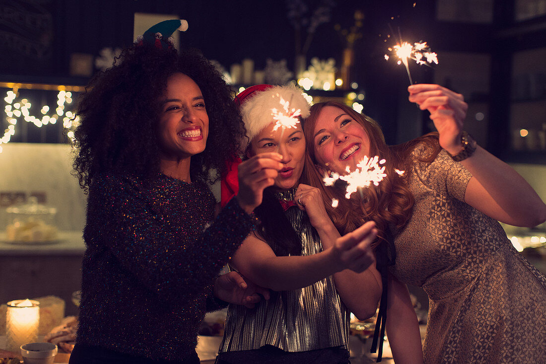 Playful young women with sparklers
