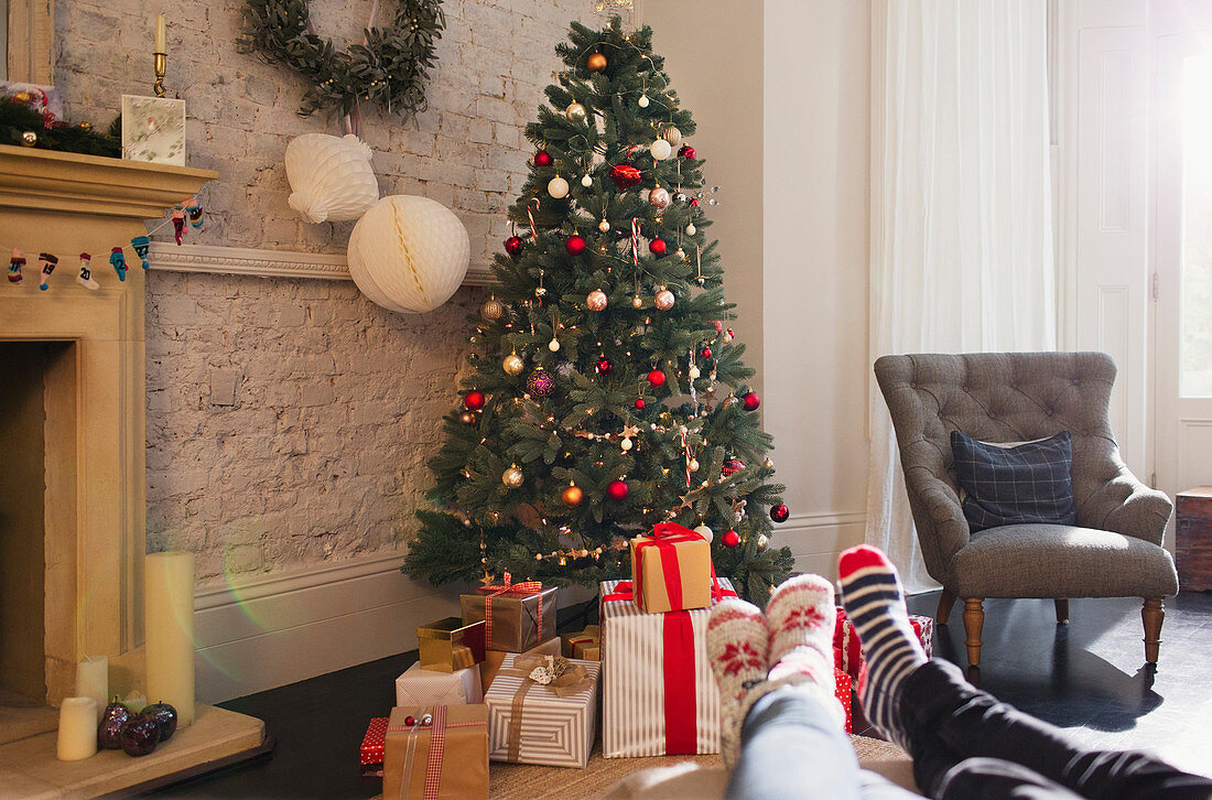 Relaxed couple near Christmas tree