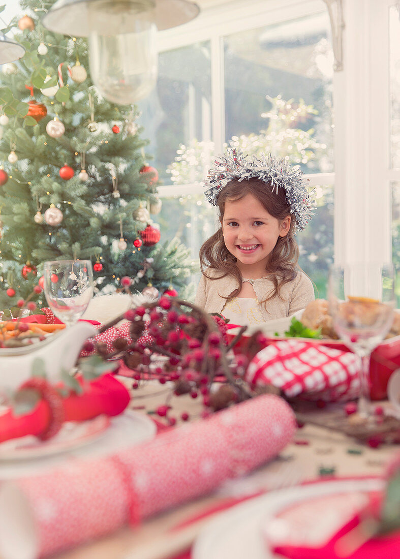Portrait smiling girl at Christmas table
