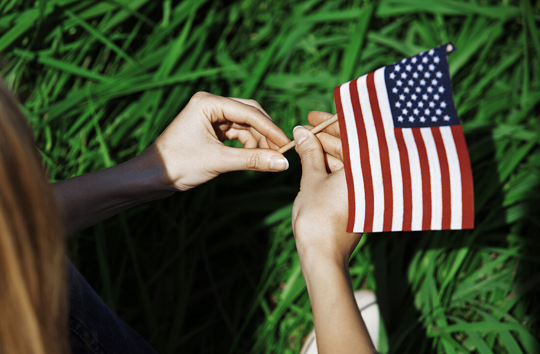 Woman holding American flag