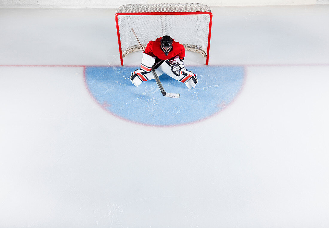 Hockey goalie in red uniform