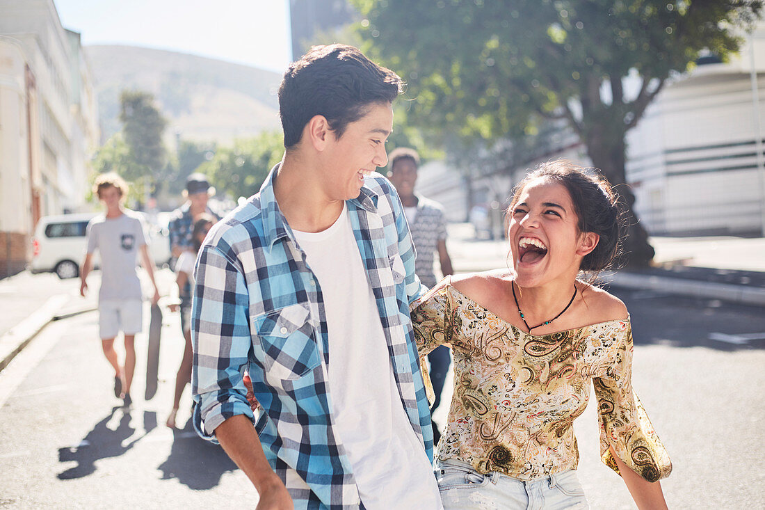 Laughing teenage couple