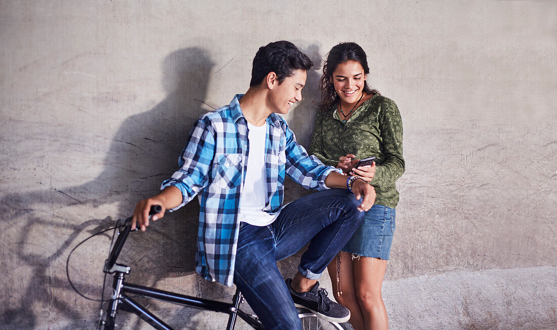 Teenage couple with BMX bicycle