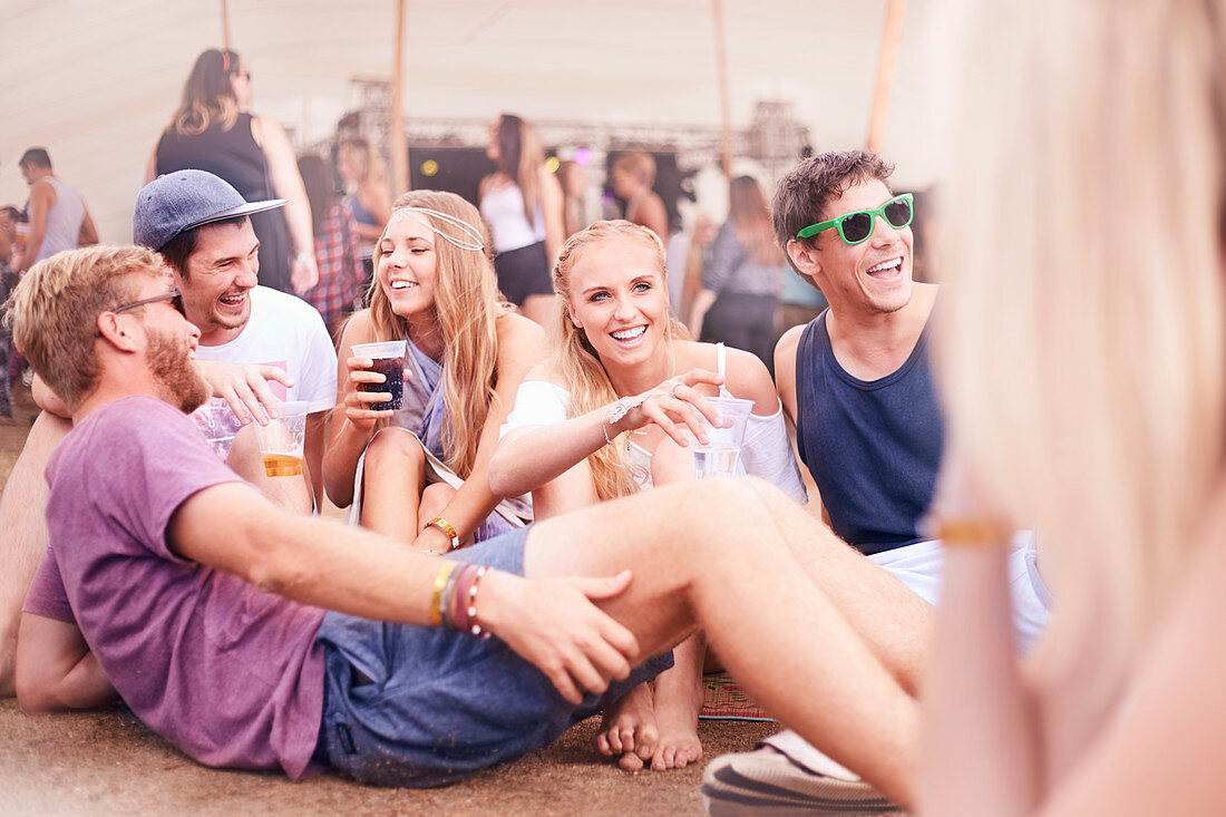 Friends drinking at music festival