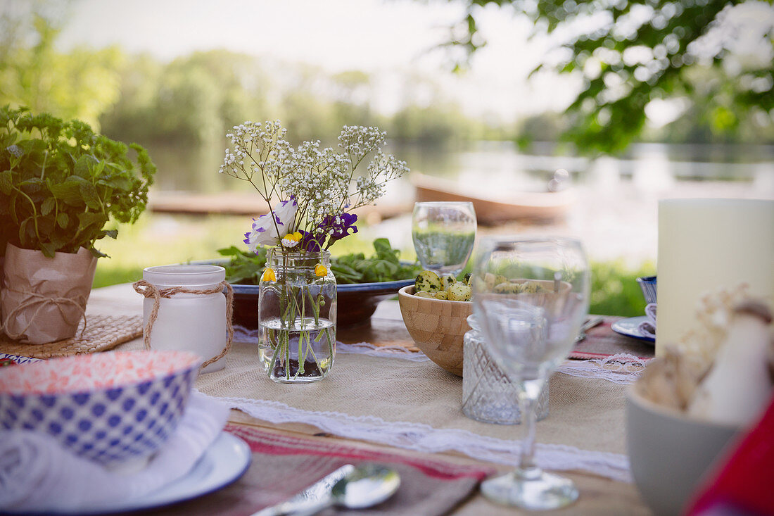 Place settings and bouquet on table