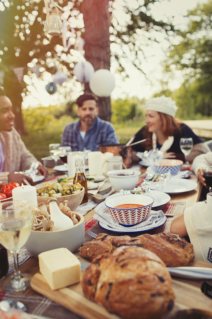 Friends enjoying lunch at patio table