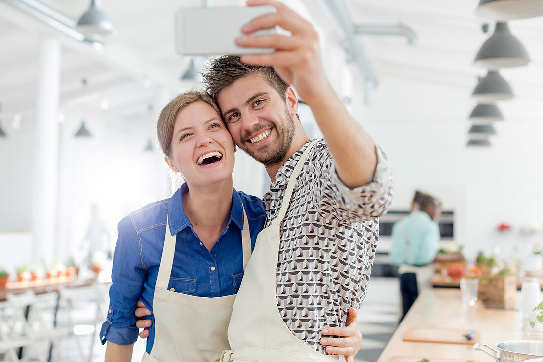 Couple taking selfie in cooking class