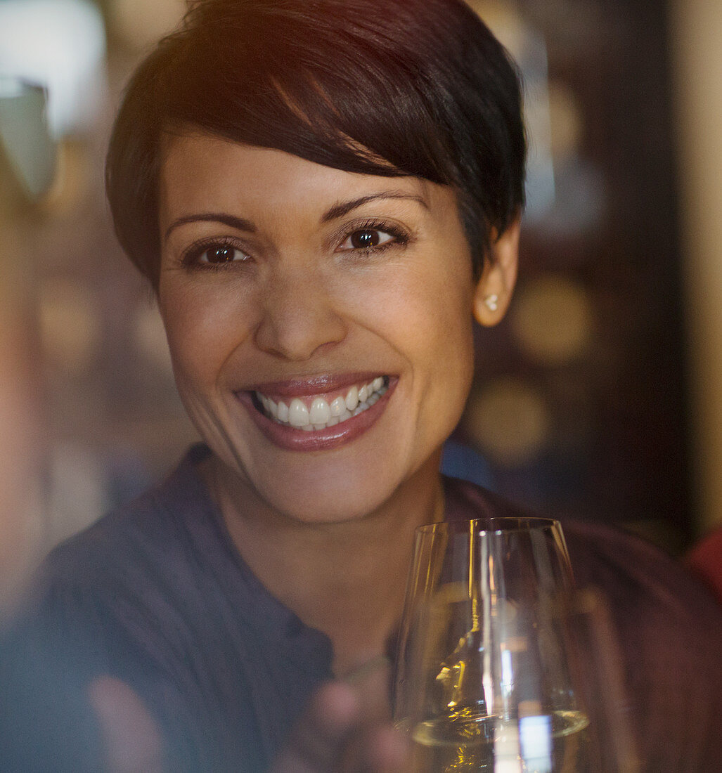 Close up portrait woman drinking white wine
