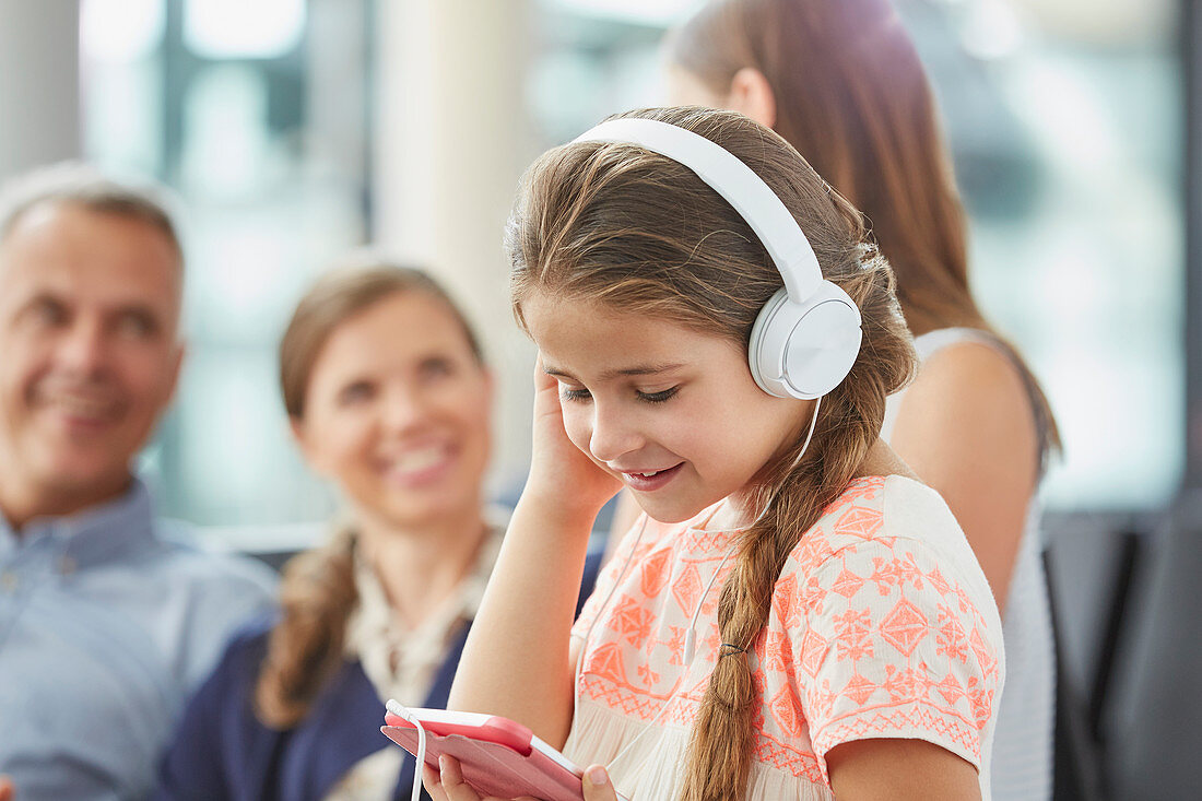 Girl listening to music with mp3 player