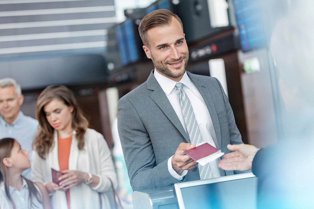 Businessman with passport at airport check-in