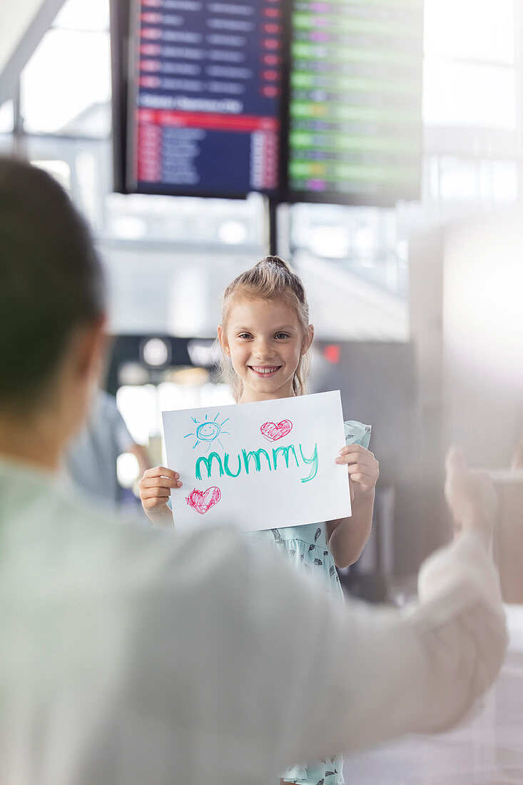 Daughter welcoming mother at airport