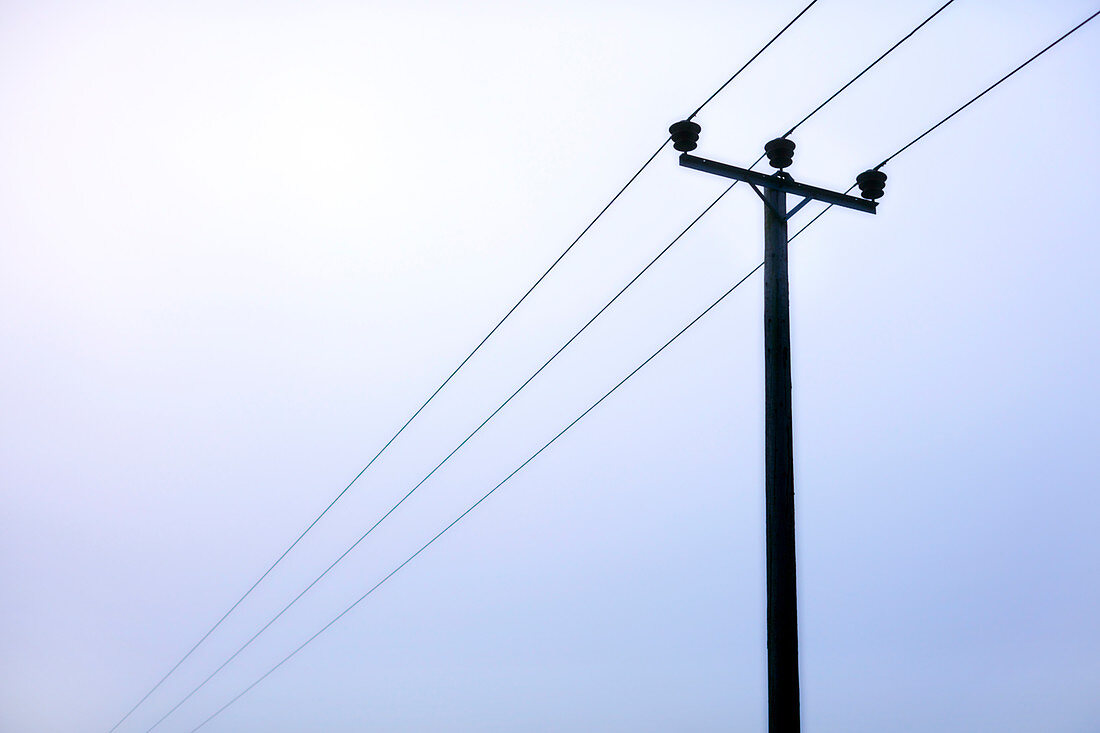 Power lines under overcast sky