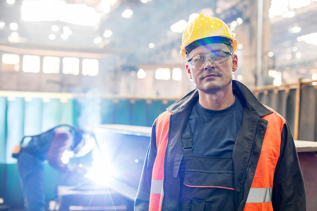 Portrait confident steel worker in factory