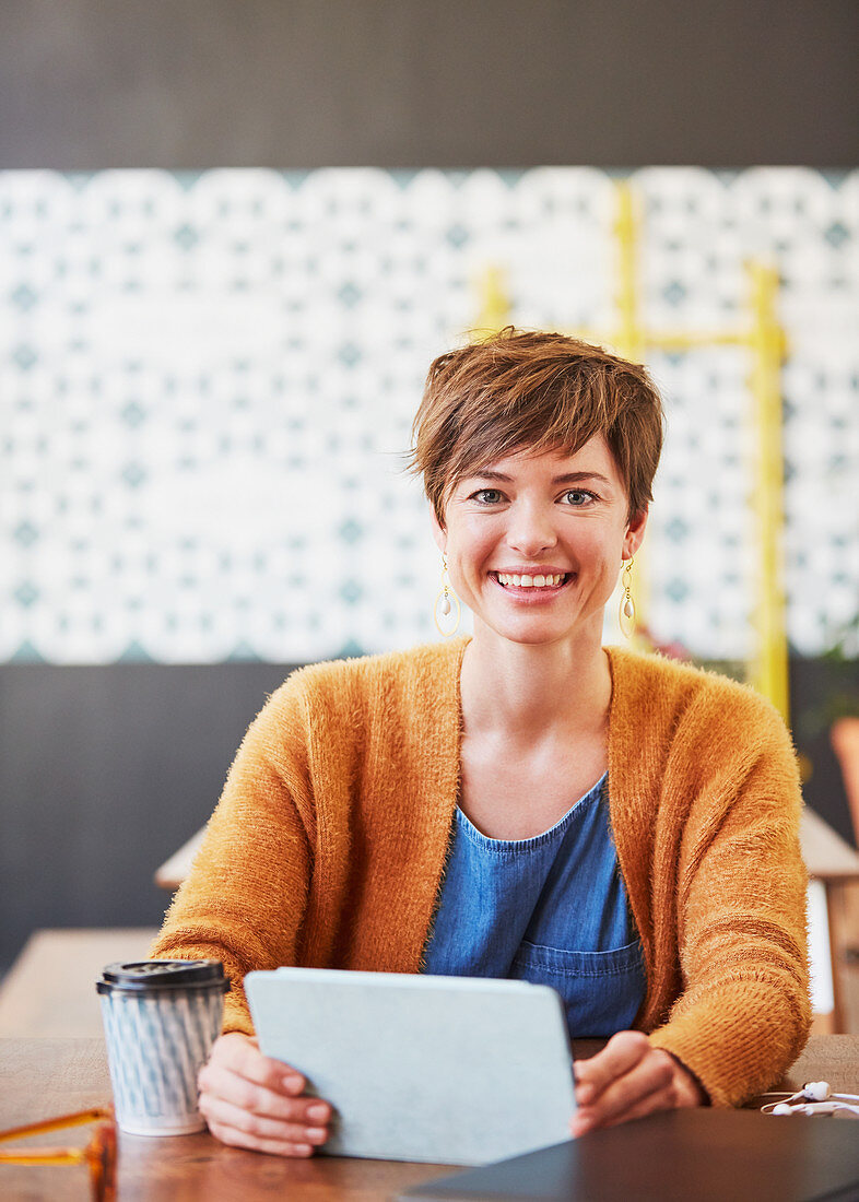 Portrait smiling businesswoman drinking coffee
