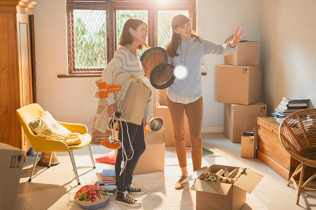 Mother helping daughter move into new apartment