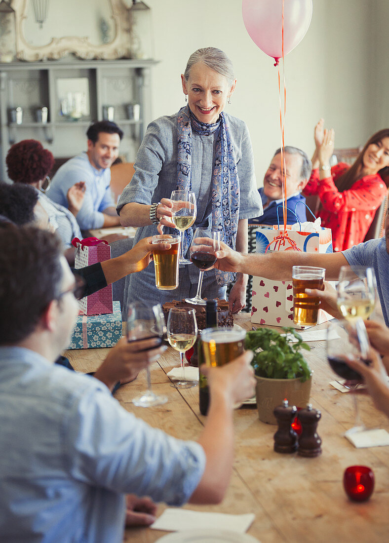 Friends toasting wine and beer glasses