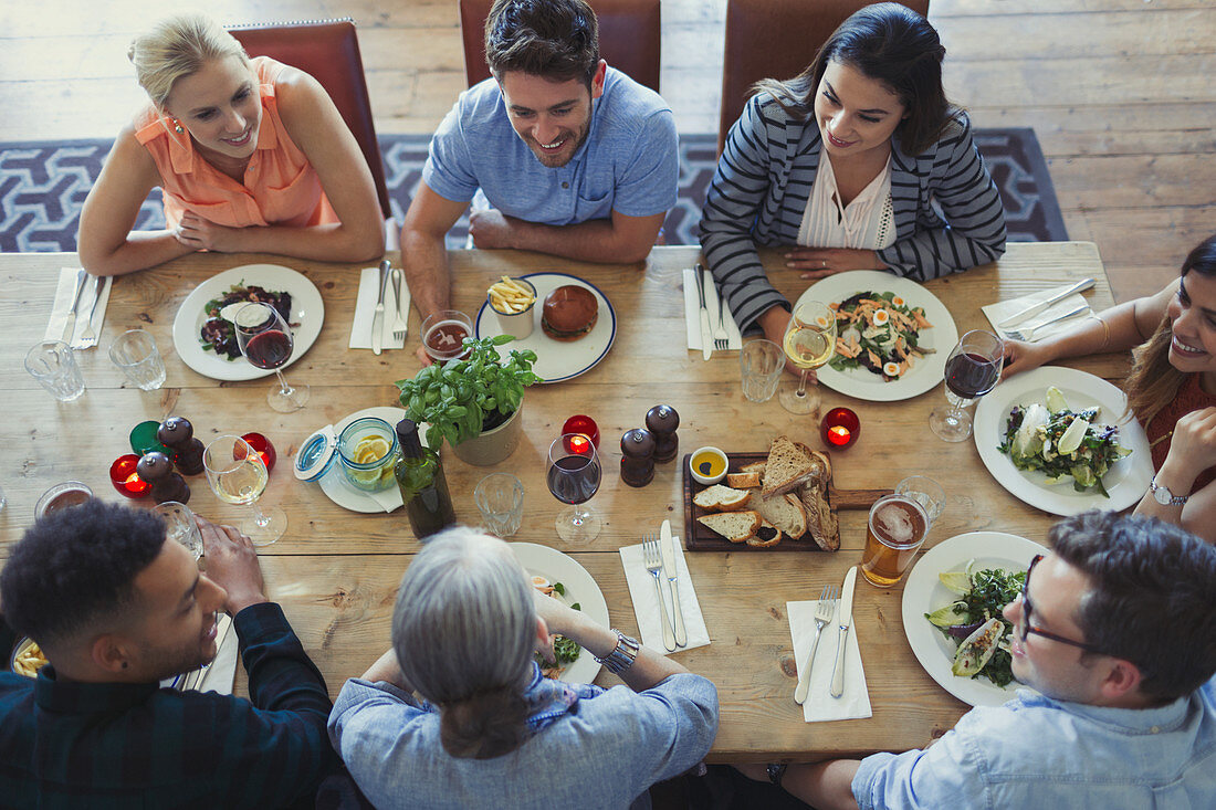 Overhead view friends talking and dining