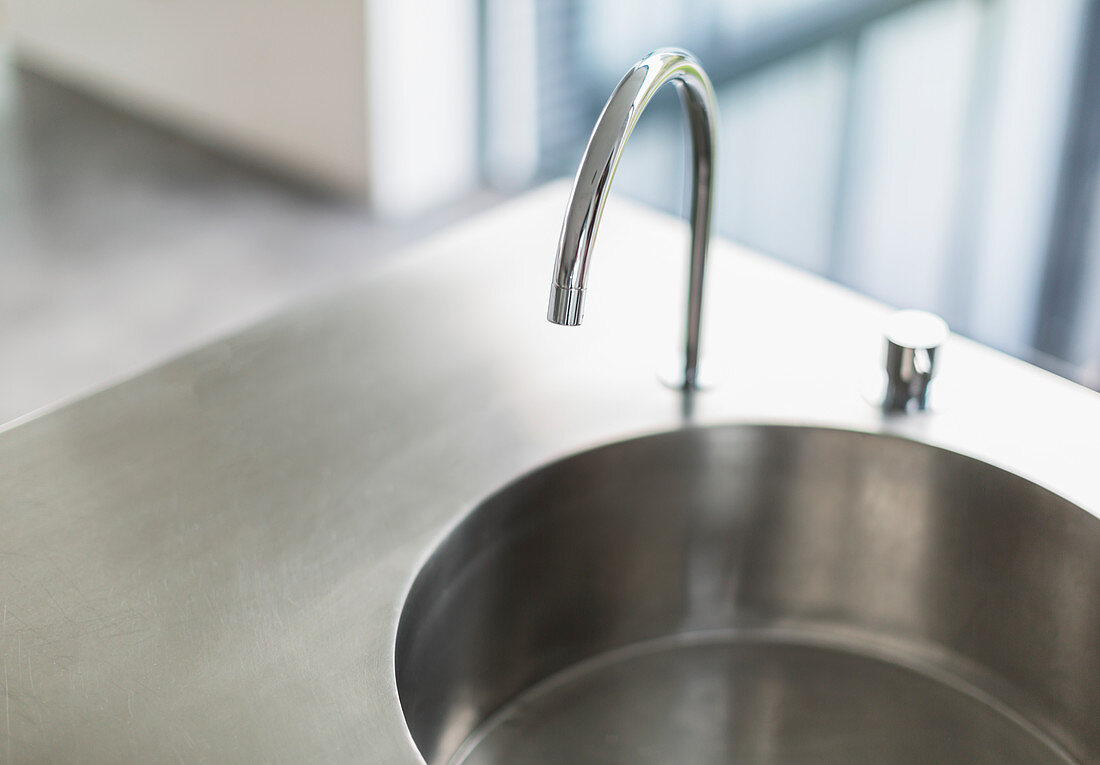 Stainless steel kitchen sink and faucet