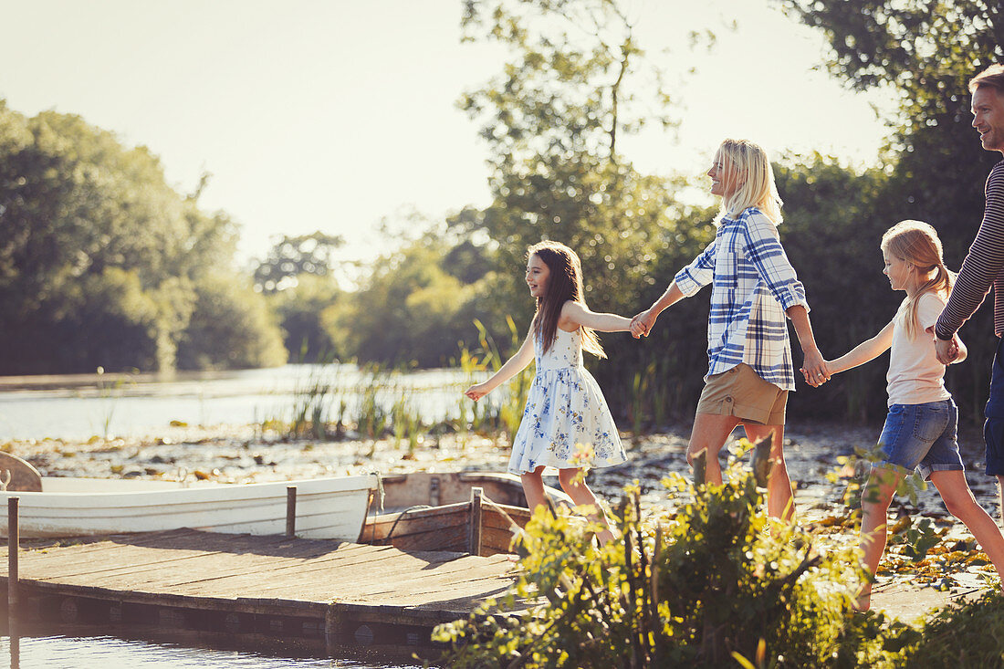 Family holding hands and walking