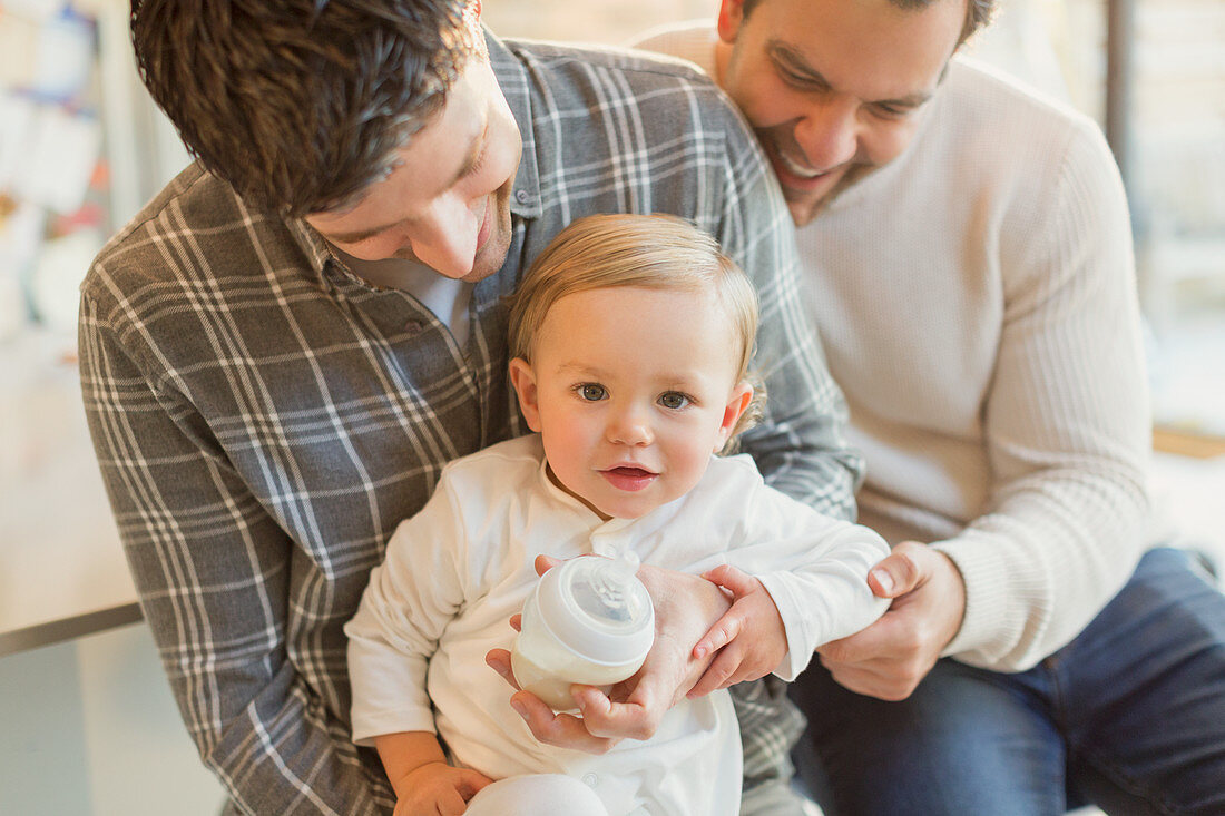 Portrait baby son with male gay parents