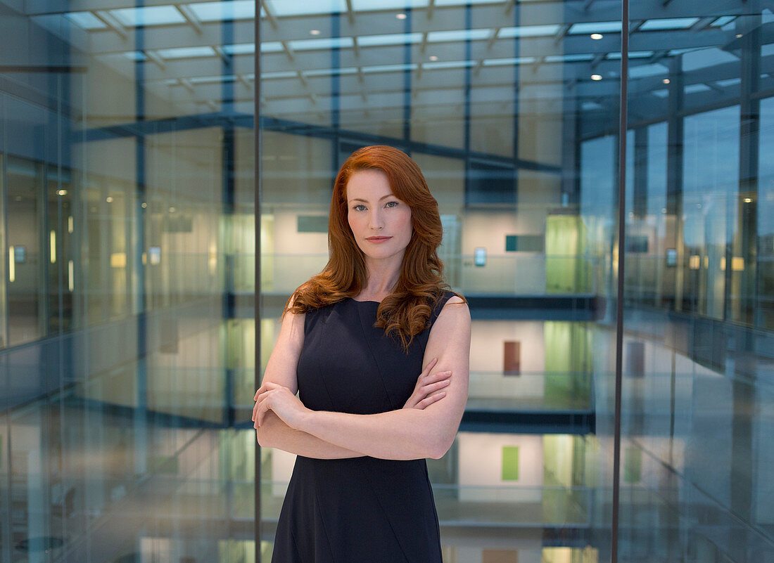 Businesswoman in modern office atrium