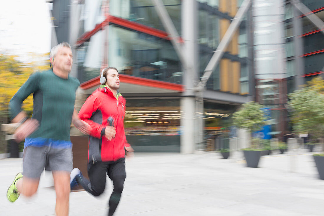 Men with headphones running