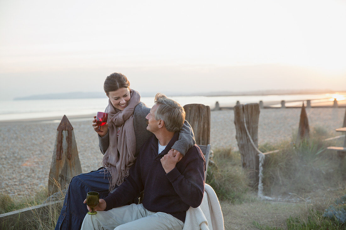 Affectionate mature couple drinking wine