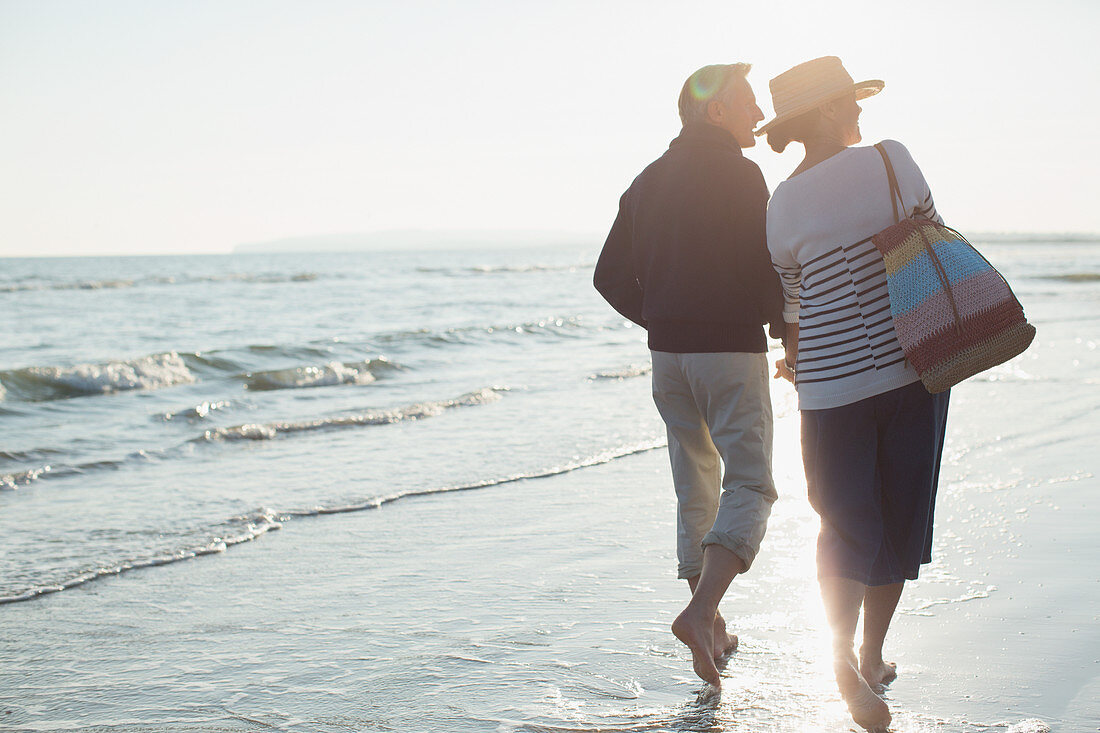 Barefoot mature couple walking