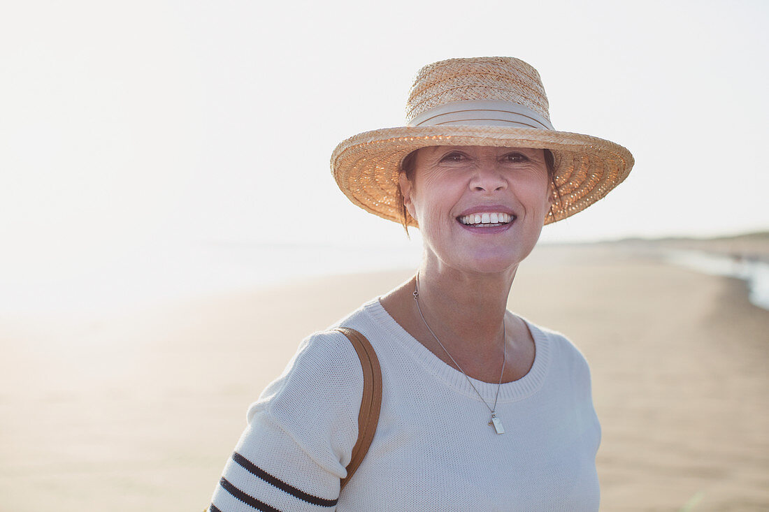 Portrait mature woman wearing straw hat
