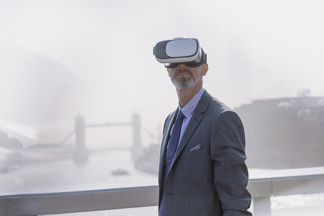 Businessman using VR simulator glasses, London, UK