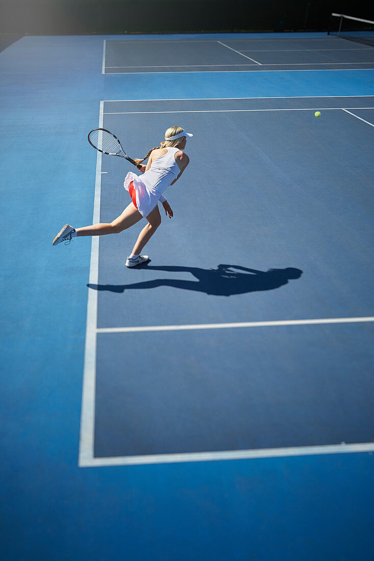 Young tennis player playing tennis