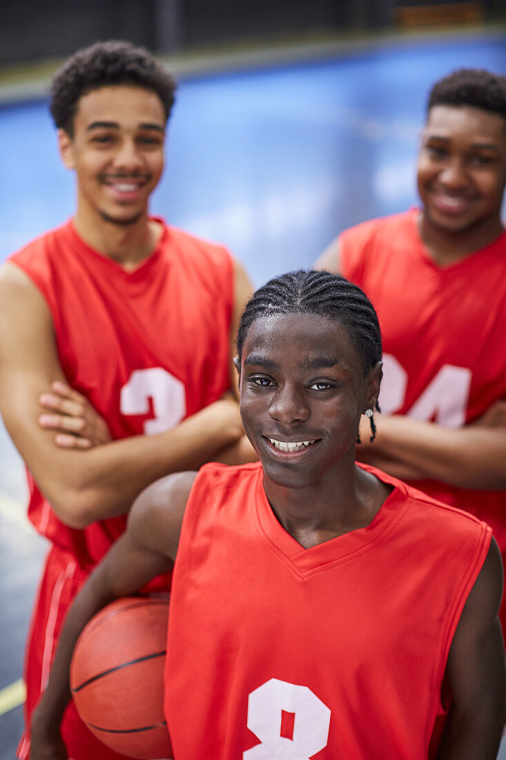 Portrait basketball player team in red jerseys
