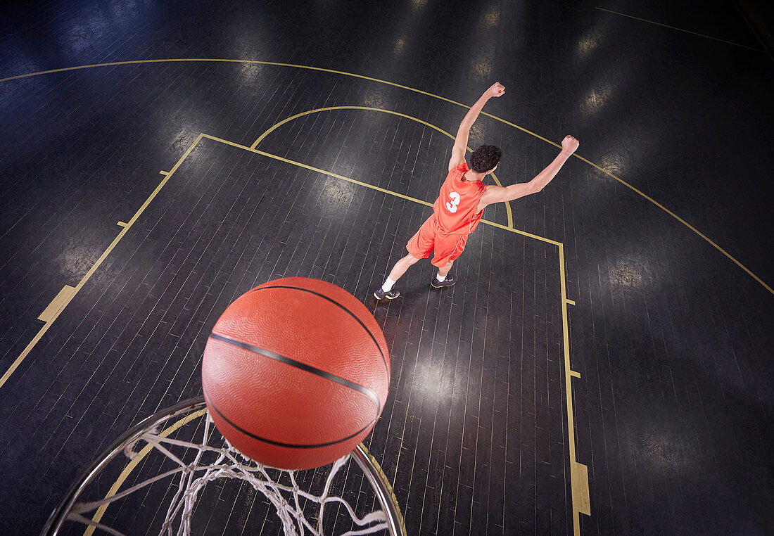 Confident basketball player shooting the ball