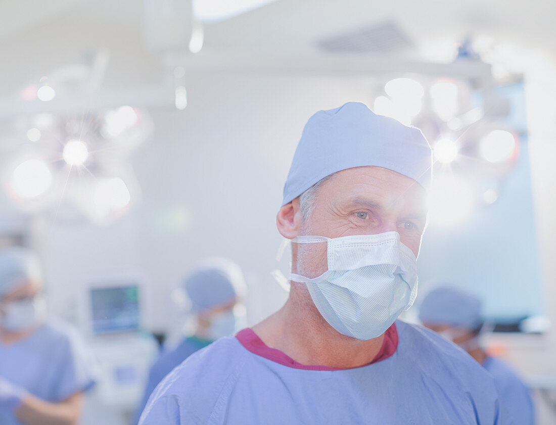 Mature male surgeon in surgical mask